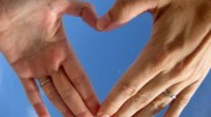 Leon Brocard's photo of two hands forming a heart shape symbolizes love.